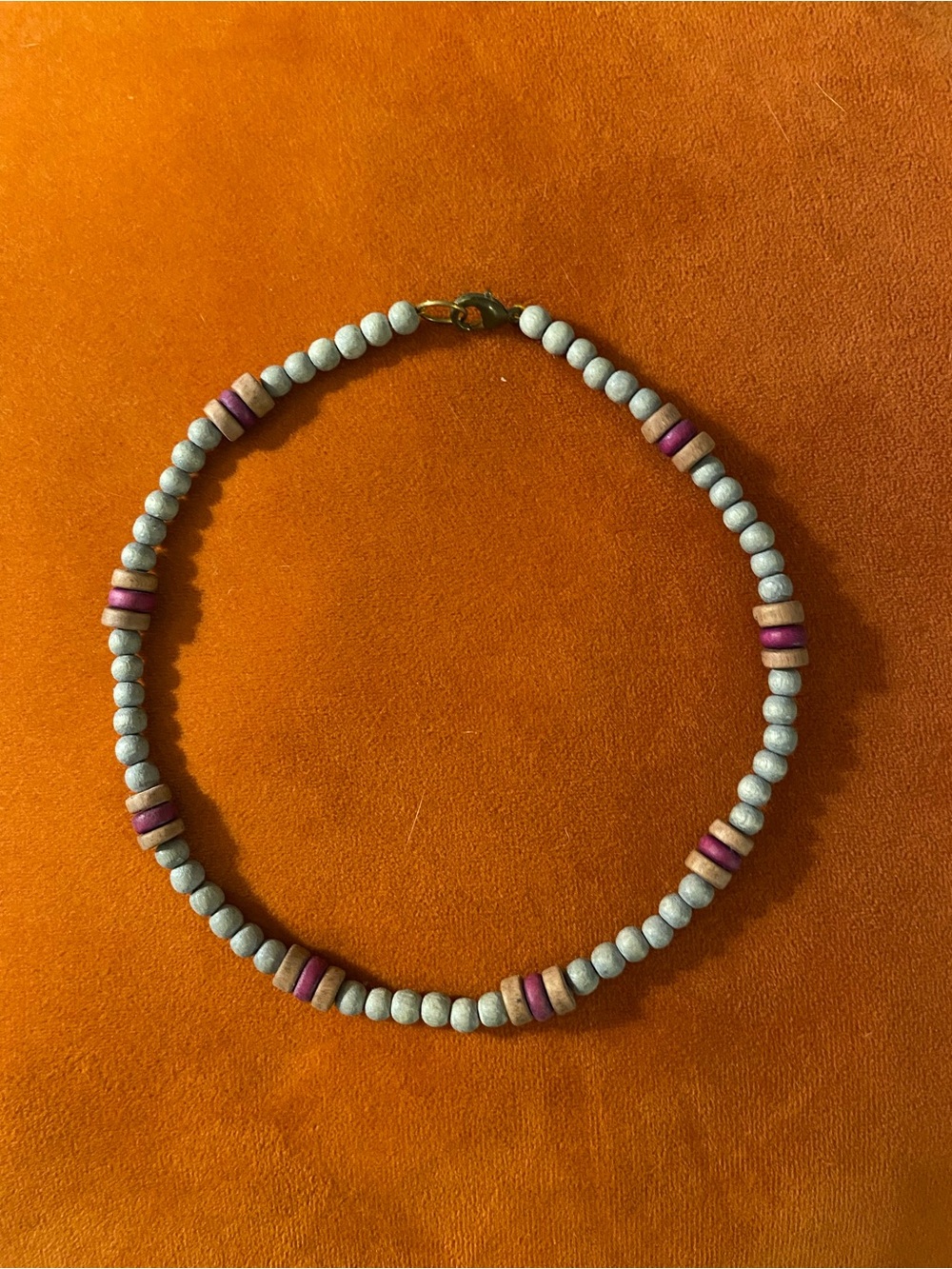 Grey, maroon, and tan choker